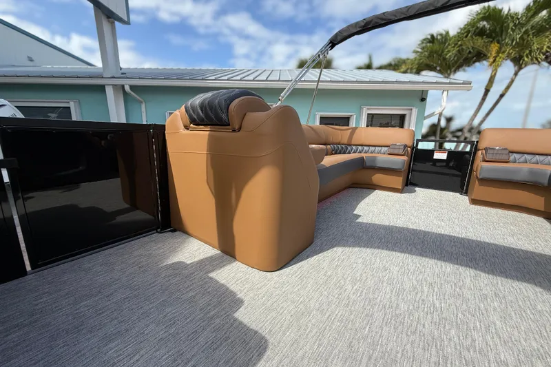 Slide: The Image of 2026 Bennington 30 QXSBAX2 pontoon boat with luxurious seating and modern design. - 13