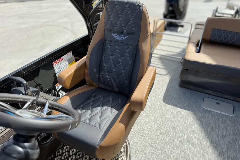 Slide: The Image of Luxury captain's chair on 2026 Bennington 30 QXSBAX2 boat, featuring premium leather upholstery. - 16