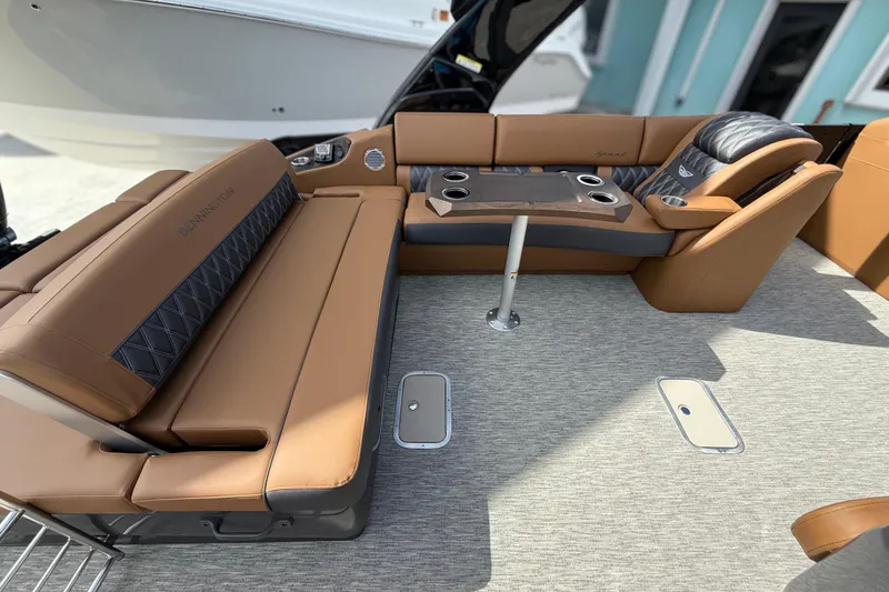 Slide: The Image of Luxurious seating on 2026 Bennington 30 QXSBAX2 boat with tan and black upholstery. - 18