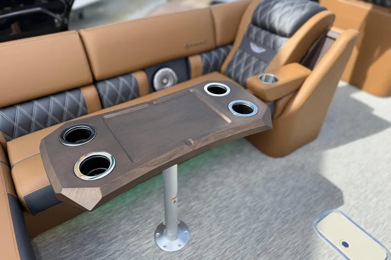 Slide: The Image of Luxurious seating and table on 2026 Bennington 30 QXSBAX2 boat, featuring cup holders. - 19