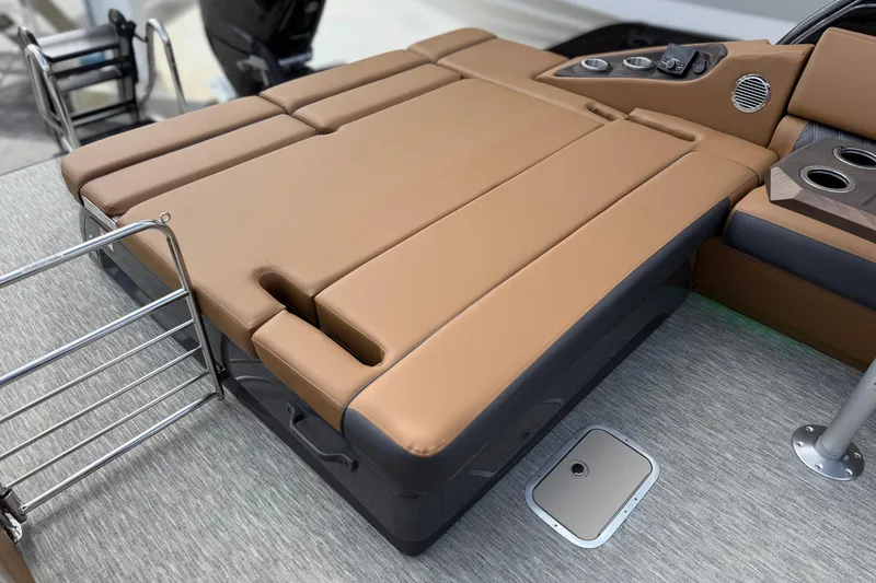 Slide: The Image of Luxurious seating area on 2026 Bennington 30 QXSBAX2 boat with tan upholstery and cup holders. - 25