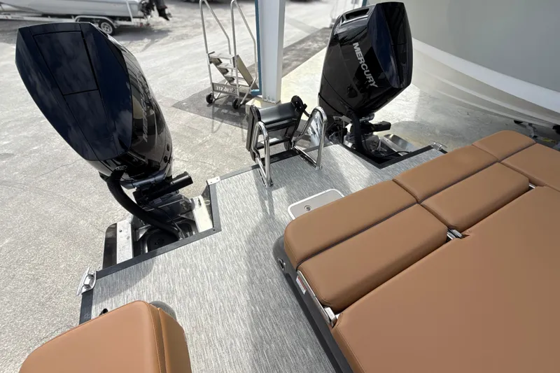 Slide: The Image of 2026 Bennington 30 QXSBAX2 boat with dual Mercury outboard engines and brown seating. - 27