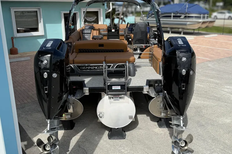 Slide: The Image of 2026 Bennington 30 QXSBAX2 boat with dual V12 engines, docked outdoors. - 3