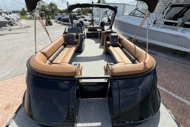 Slide: The Image of Luxurious 2026 Bennington 30 QXSBAX2 pontoon boat with spacious seating and sleek design. - 6
