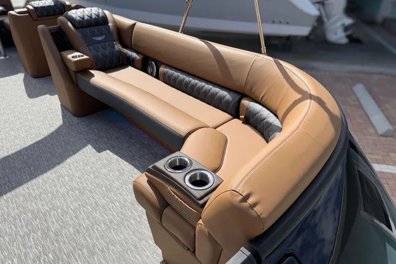 Slide: The Image of Luxurious seating on 2026 Bennington 30 QXSBAX2 boat with tan and black upholstery. - 8