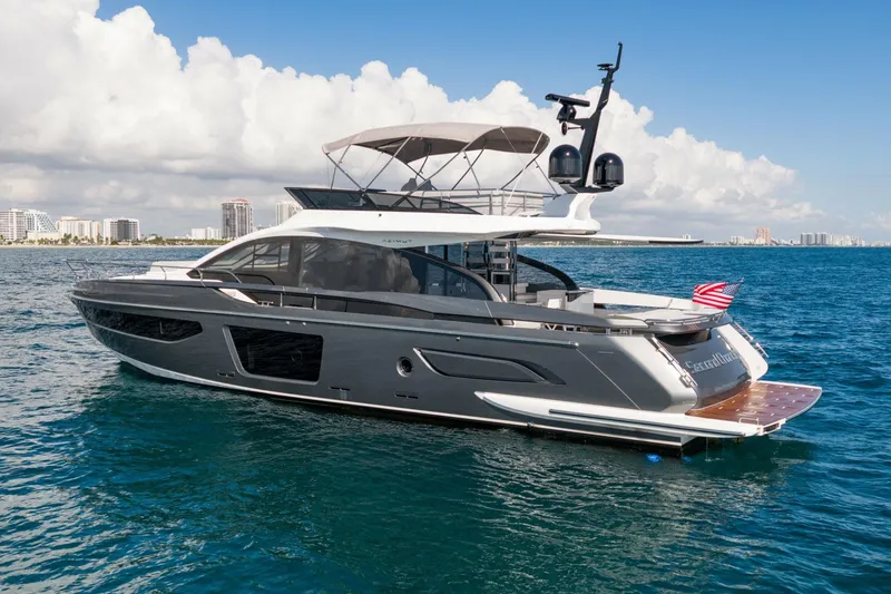 Slide: The Image of 2024 Azimut S7 yacht cruising on blue ocean waters under a clear sky. - 10