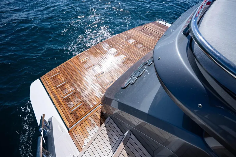 Slide: The Image of 2024 Azimut S7 yacht with sleek design and wooden deck on open water. - 13
