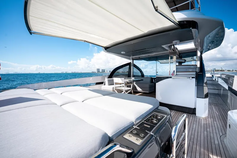 Slide: The Image of Luxurious 2024 Azimut S7 yacht deck with sunbed and ocean view. - 14