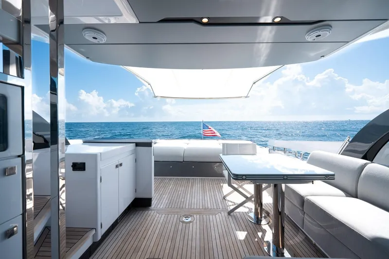 Slide: The Image of Luxurious 2024 Azimut S7 yacht deck with ocean view, featuring sleek seating and modern design. - 16