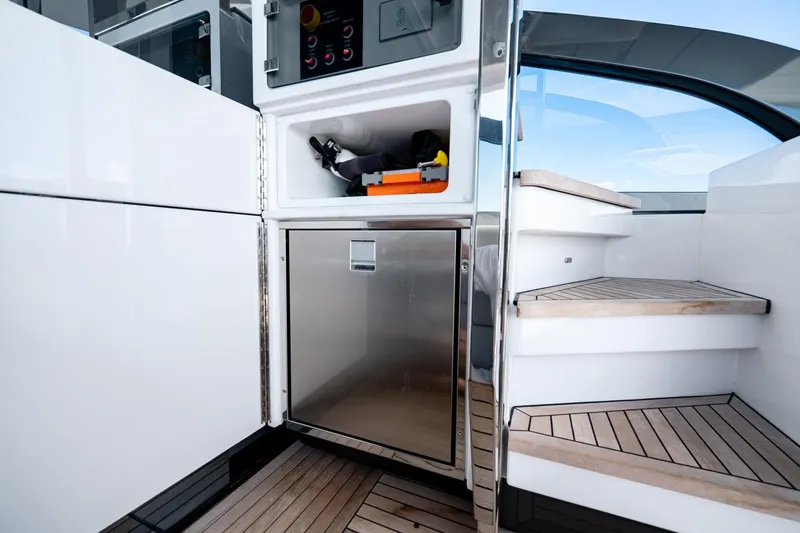 Slide: The Image of 2024 Azimut S7 yacht interior with sleek cabinetry and wooden steps. - 21