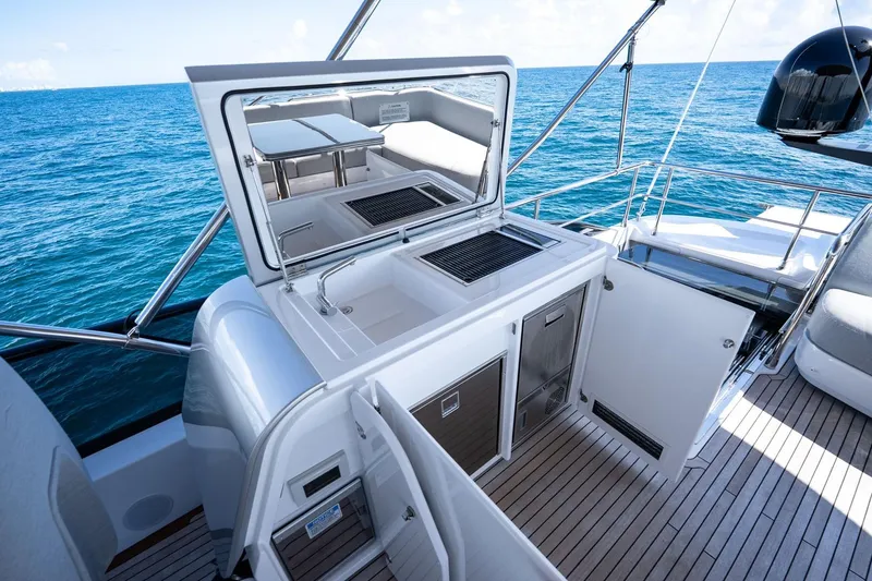 Slide: The Image of Luxury Azimut S7 2024 yacht deck with outdoor kitchen and ocean view. - 23