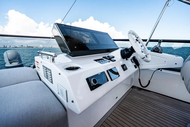 Slide: The Image of Helm of 2024 Azimut S7 yacht with modern controls and ocean view. - 24