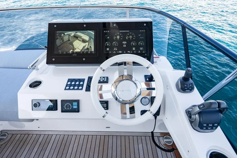 Slide: The Image of Cockpit of 2024 Azimut S7 yacht with modern steering and control panels. - 25