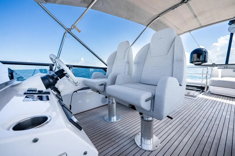 Slide: The Image of Luxury helm seats on 2024 Azimut S7 yacht, featuring sleek design and ocean view. - 26
