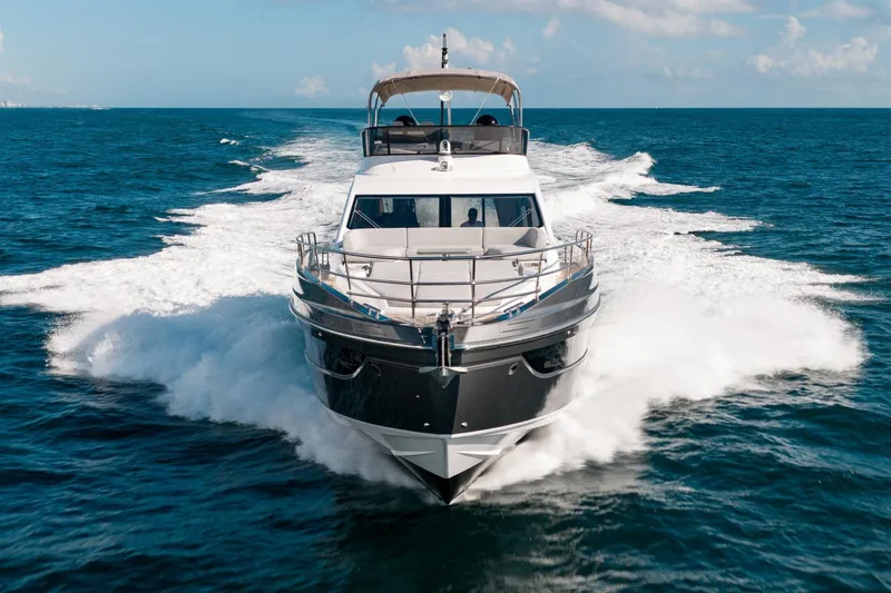 Slide: The Image of 2024 Azimut S7 yacht cruising on open sea, creating dynamic water splashes. - 3