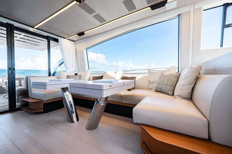 Slide: The Image of Luxurious interior of 2024 Azimut S7 yacht with elegant seating and ocean view. - 36