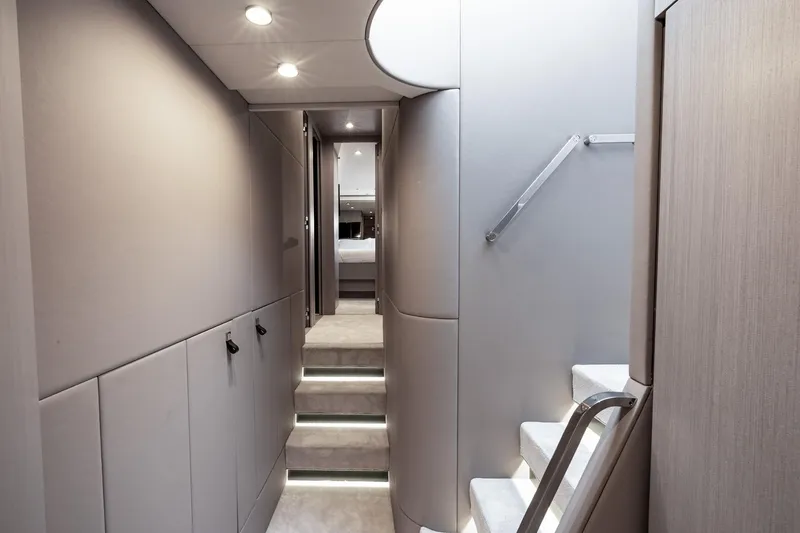 Slide: The Image of Luxurious interior of 2024 Azimut S7 yacht with modern staircase and ambient lighting. - 48