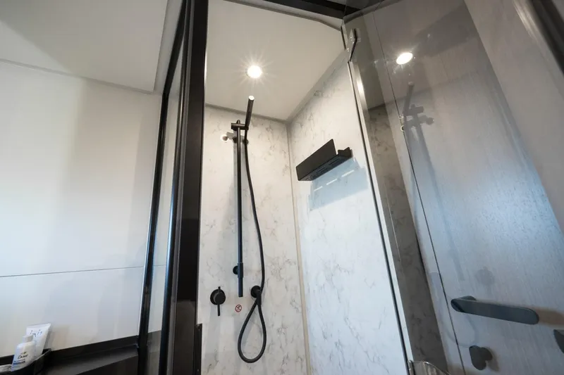 Slide: The Image of Luxurious shower in 2024 Azimut S7 yacht, featuring modern fixtures and elegant design. - 55