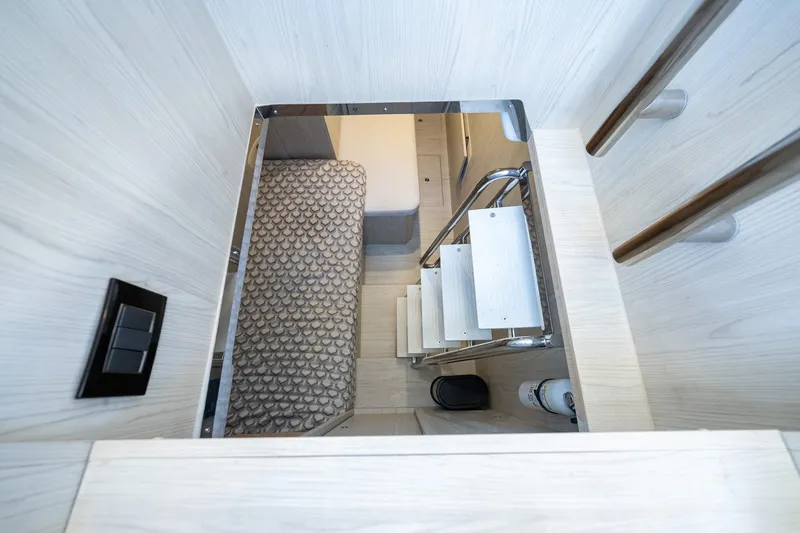 Slide: The Image of Interior view of 2024 Azimut S7 yacht, featuring a compact staircase and modern design. - 57