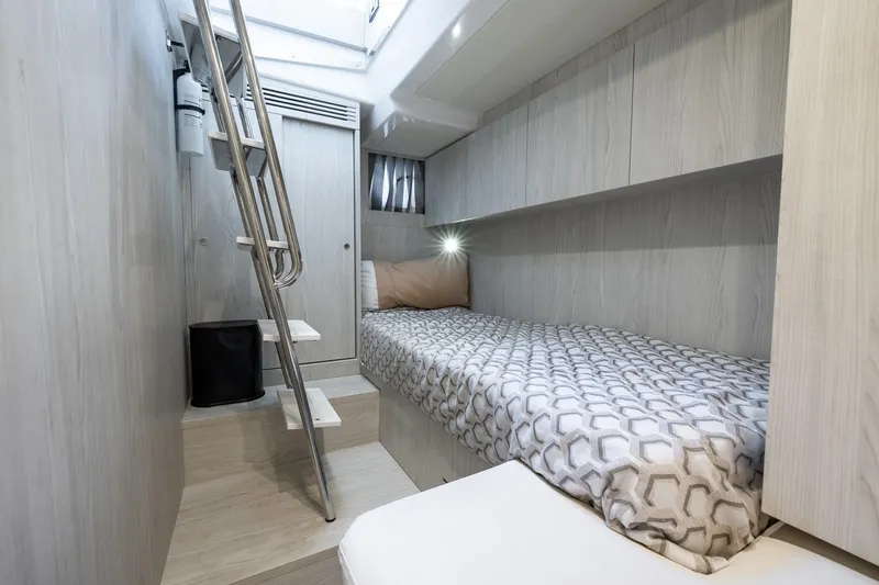 Slide: The Image of 2024 Azimut S7 yacht cabin with modern design, single bed, and ladder access. - 58