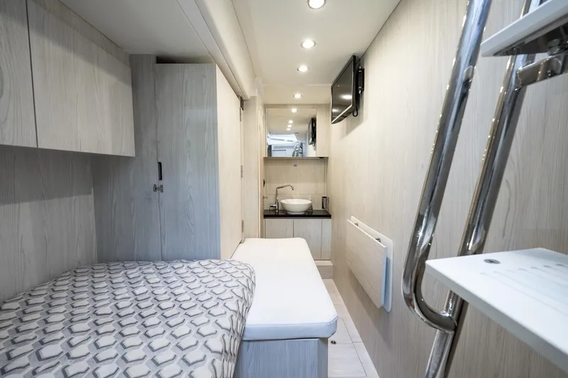 Slide: The Image of 2024 Azimut S7 yacht interior cabin with modern design and compact amenities. - 60