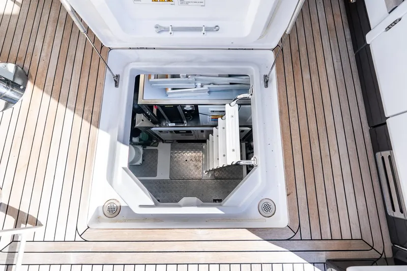 Slide: The Image of Engine room access hatch on 2024 Azimut S7 yacht with wooden deck. - 61