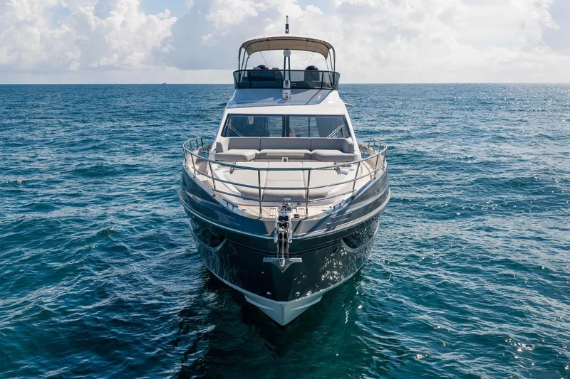 Slide: The Image of 2024 Azimut S7 yacht on open sea, front view under clear sky. - 7