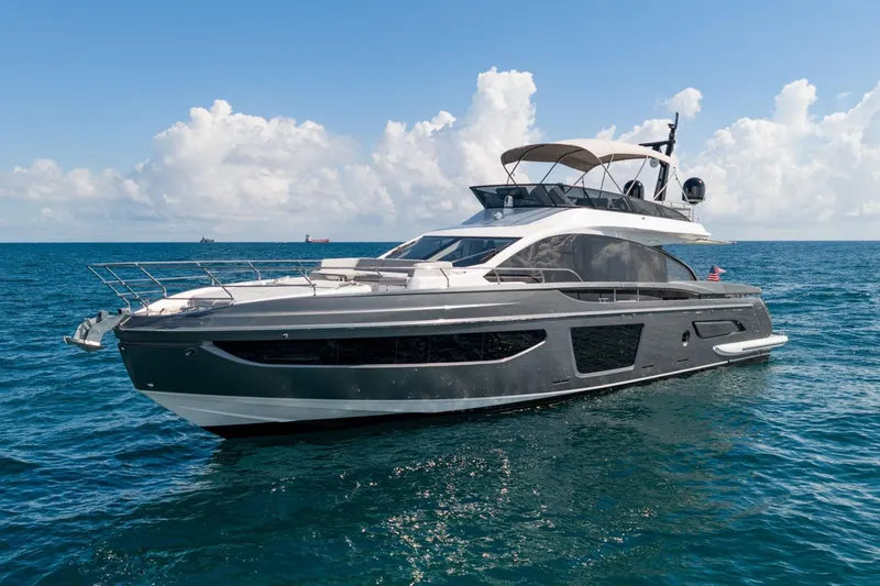 Slide: The Image of 2024 Azimut S7 yacht cruising on open sea under clear skies. - 8