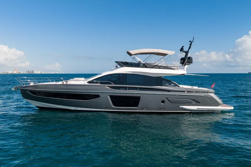 Slide: The Image of 2024 Azimut S7 yacht cruising on open water under a clear blue sky. - 9