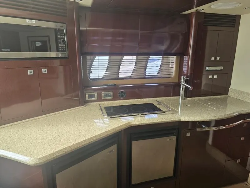 Slide: The Image of Luxurious kitchen interior of 2008 Sea Ray 40 Sundancer yacht with modern appliances. - 14