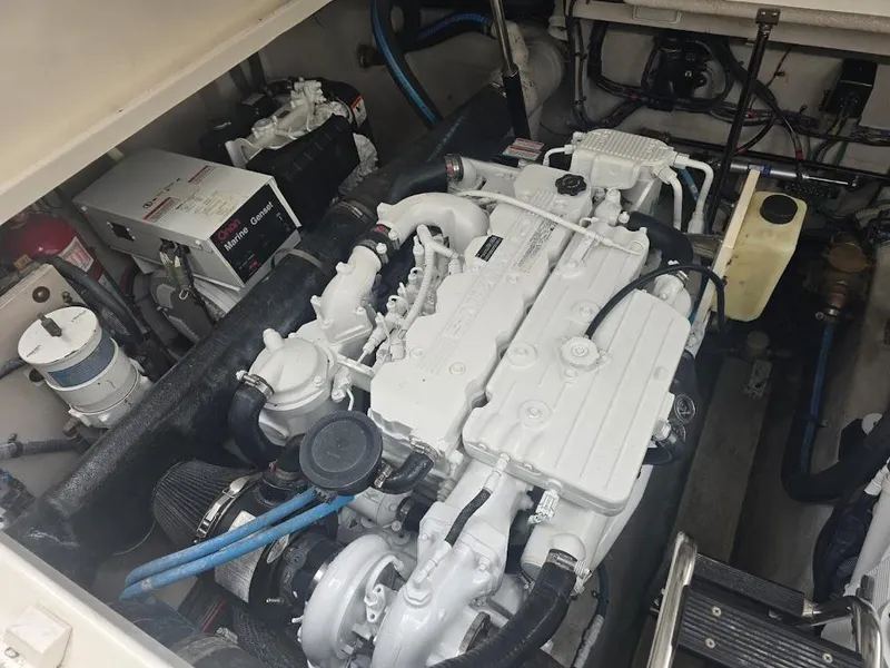 Slide: The Image of Engine room of 2008 Sea Ray 40 Sundancer, featuring a clean, well-maintained marine engine. - 24
