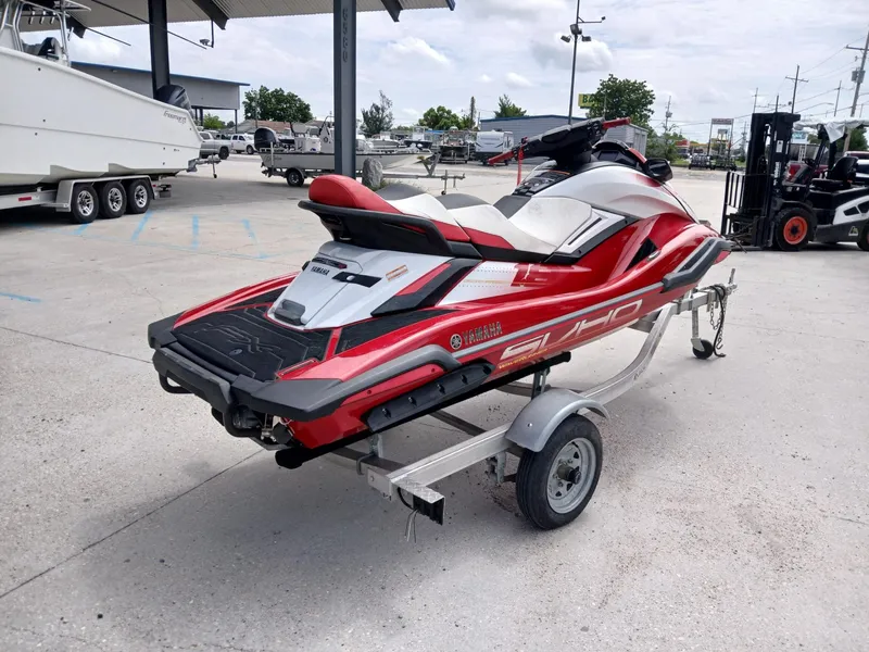 Slide: The Image of 2021 Yamaha WaveRunner FX SVHO in red and white on a trailer at a dealership. - 4