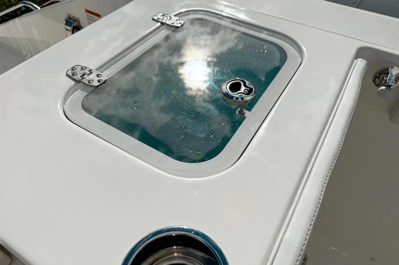 Slide: The Image of 2026 Pursuit S 328 Sport boat deck with sunlit hatch and stainless steel fittings. - 12