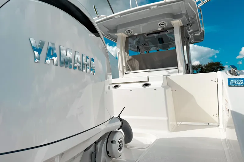 Slide: The Image of 2026 Pursuit S 328 Sport boat with Yamaha engine, showcasing sleek design and modern features. - 2