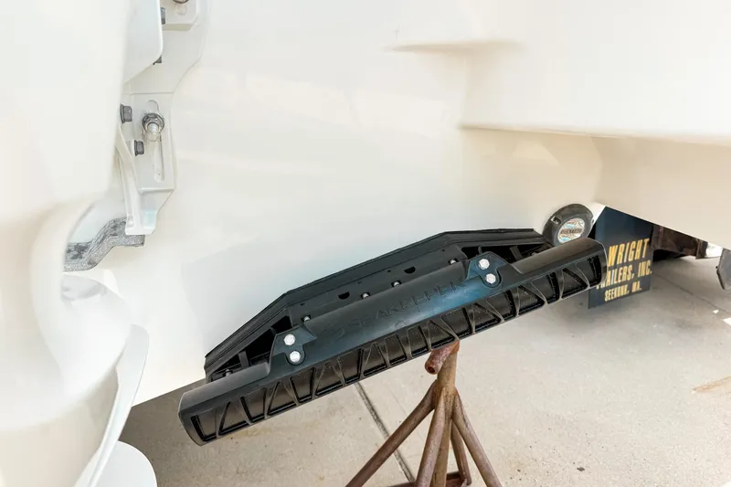 Slide: The Image of 2026 Pursuit S 328 Sport boat detail showing SeaKeeper stabilizer on trailer. - 4
