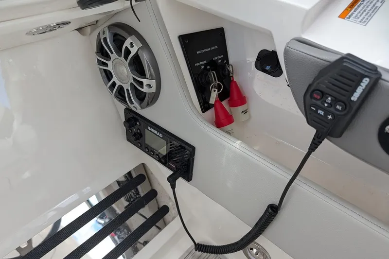 Slide: The Image of 2023 Sea Ray 310 SLX boat control panel with joystick and throttle. - 13