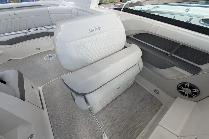 Slide: The Image of 2023 Sea Ray 310 SLX boat interior with luxurious seating and modern design. - 16