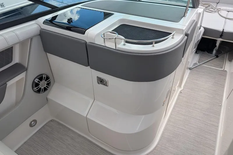 Slide: The Image of 2023 Sea Ray 310 SLX boat interior with luxurious seating and modern design. - 17