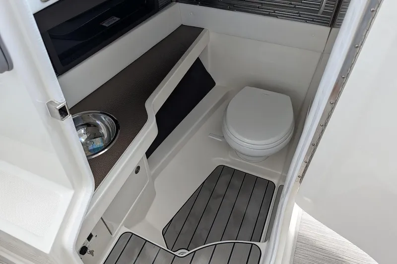 Slide: The Image of 2023 Sea Ray 310 SLX boat interior with seating and speaker system. - 18