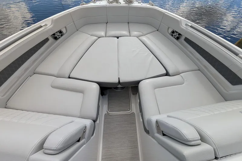 Slide: The Image of 2023 Sea Ray 310 SLX boat interior with toilet and sink, featuring modern design. - 19