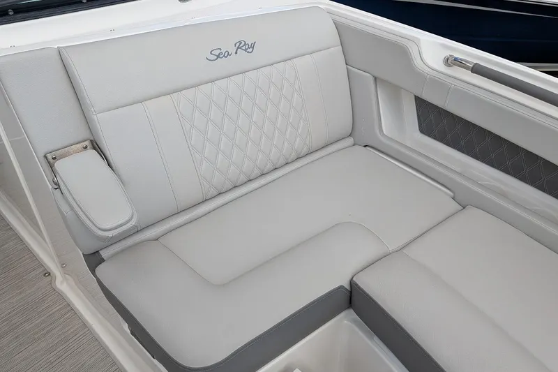 Slide: The Image of Luxurious seating area on 2023 Sea Ray 310 SLX boat, featuring plush white upholstery. - 20
