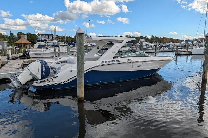 Slide: The Image of 2023 Sea Ray 310 SLX boat fuel cap and filler on deck. - 26