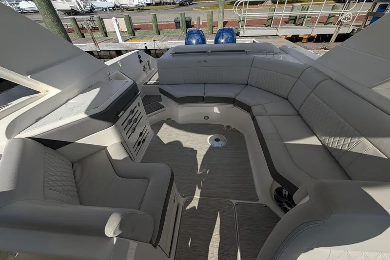 Slide: The Image of 2023 Sea Ray 310 SLX boat deck with fresh water access and power outlets. - 7