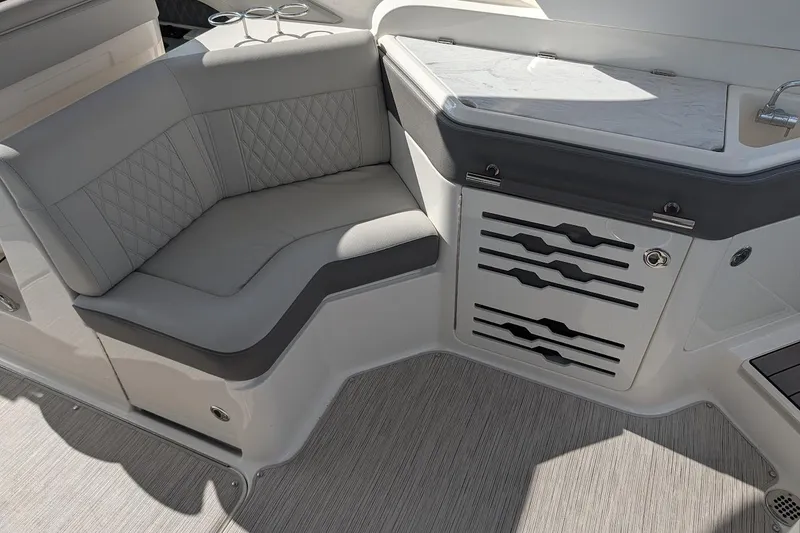 Slide: The Image of Luxurious seating area on 2023 Sea Ray 310 SLX boat with gray upholstery. - 9