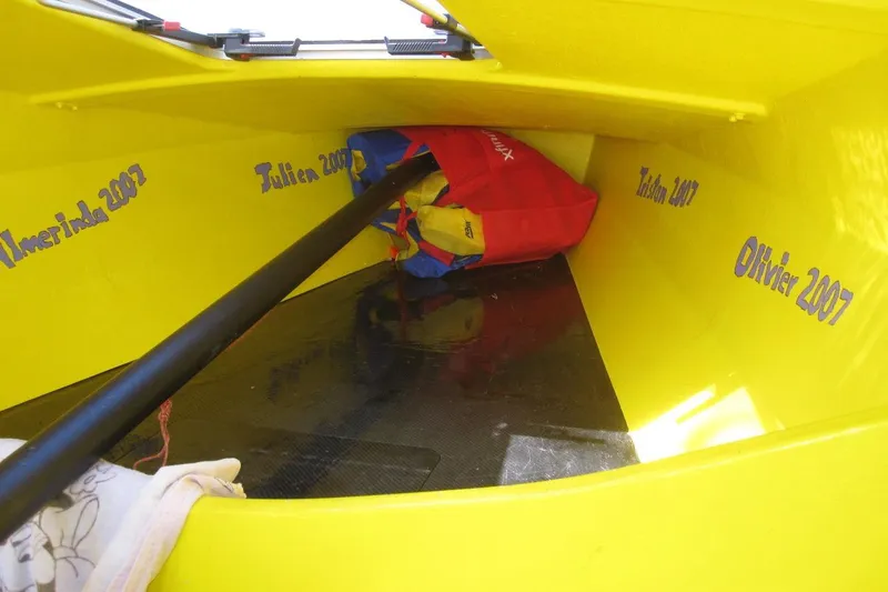 Slide: The Image of Yellow interior of 2007 Scarab 22 boat with names and equipment inside. - 9