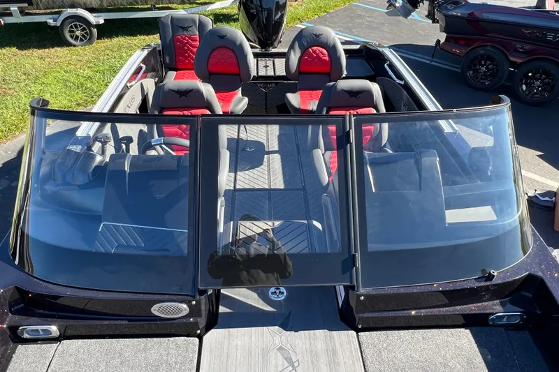 Slide: The Image of 2026 Vexus DVX20S boat with red and black seating, viewed from above. - 13
