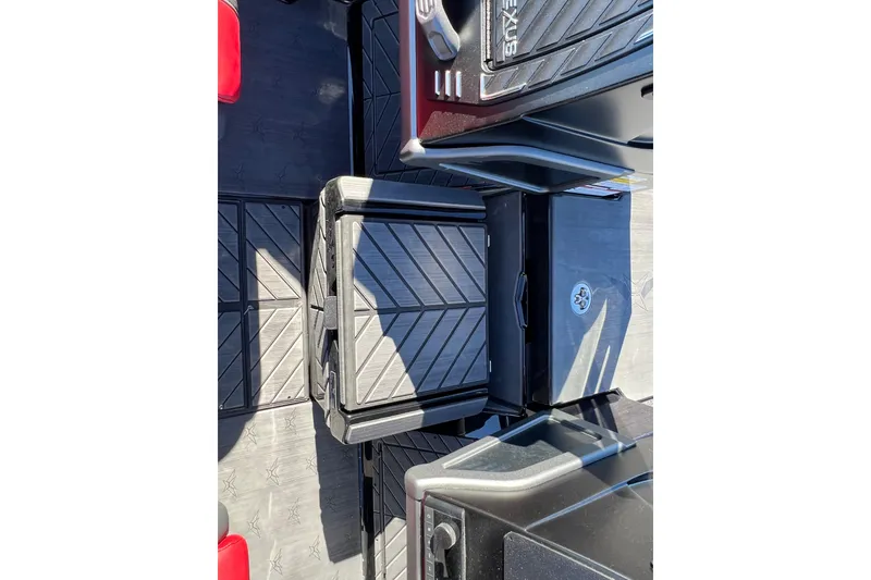 Slide: The Image of 2026 Vexus DVX20S boat interior with storage compartments and sleek design. - 16
