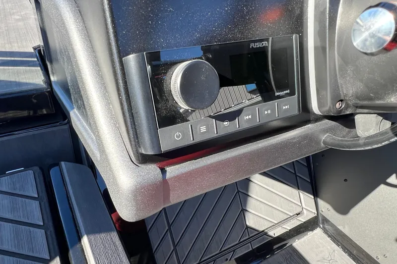 Slide: The Image of Control panel of 2026 Vexus DVX20S boat featuring a Fusion audio system. - 18