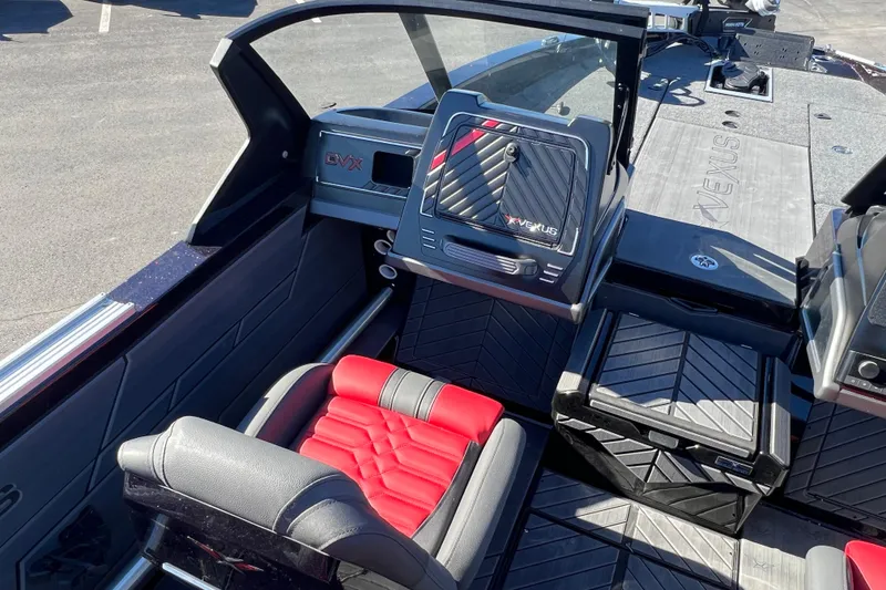 Slide: The Image of 2026 Vexus DVX20S boat interior with red and black seating, modern dashboard design. - 21
