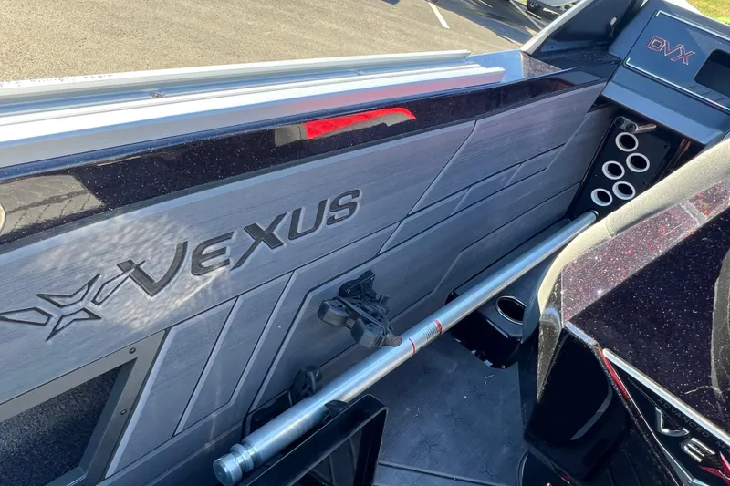 Slide: The Image of 2026 Vexus DVX20S boat interior with sleek design and rod holders. - 31